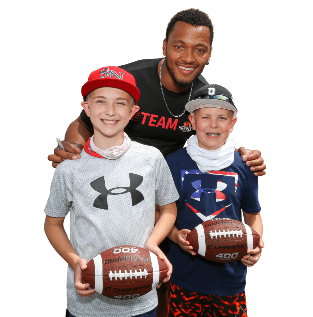 Brett Hundley with kids with footballs