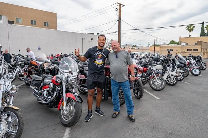 Brett and Rick in front of motorcycles